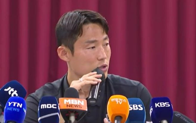The South Korean Soccer Star Son Jun-ho speaks to reporters at a press conference.
