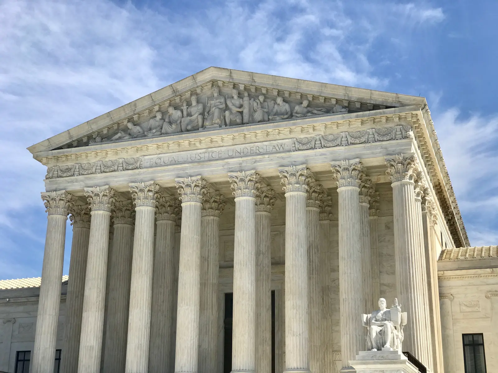 The exterior facade of the Supreme Court of the United States building, featuring its classical columns and pediment.