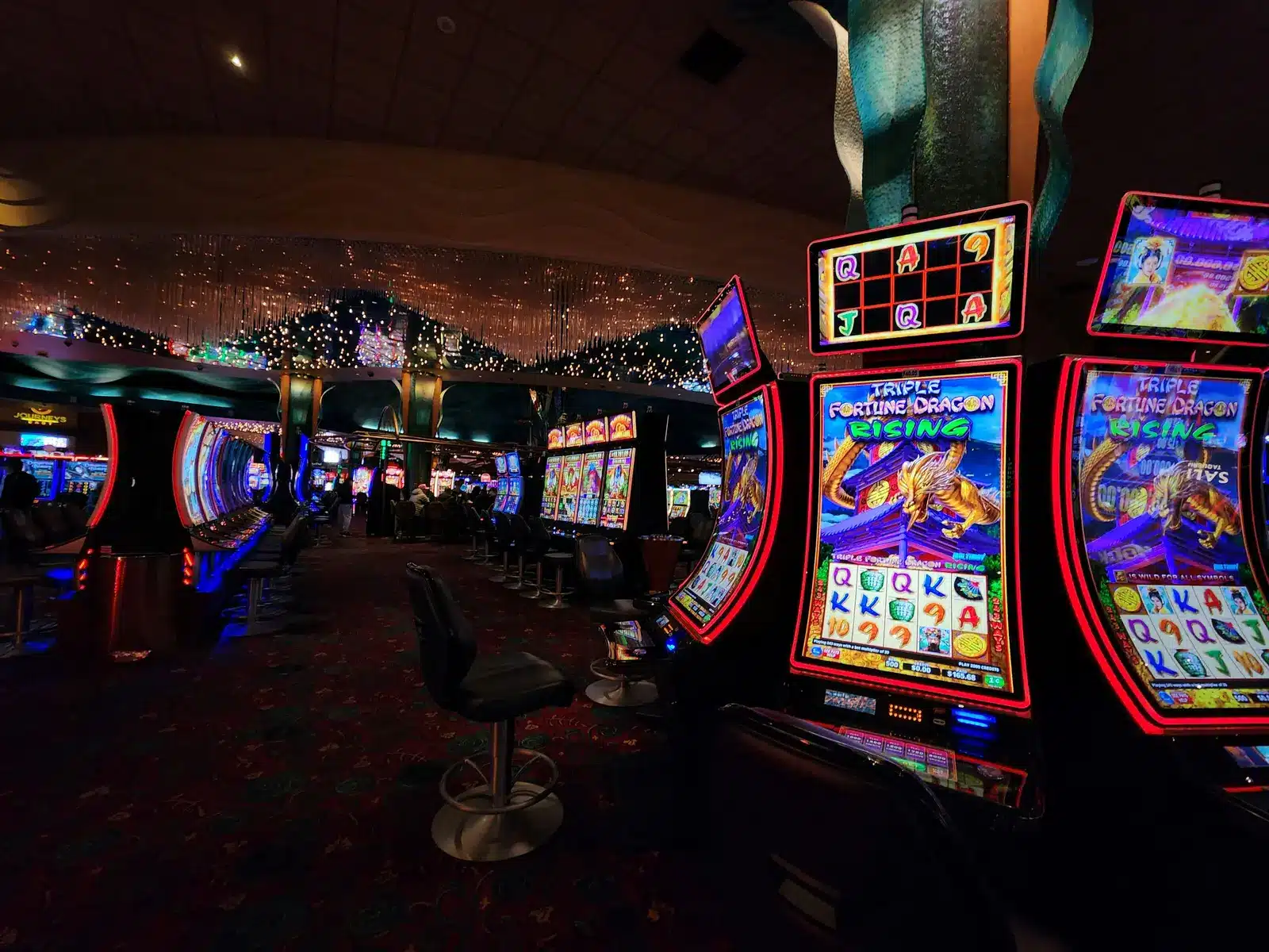 Rows of electronic slot machines on a casino gaming floor